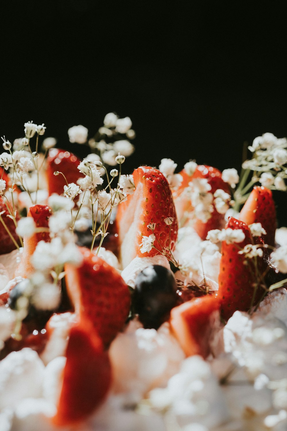 a close up of strawberries and blueberries on a plate