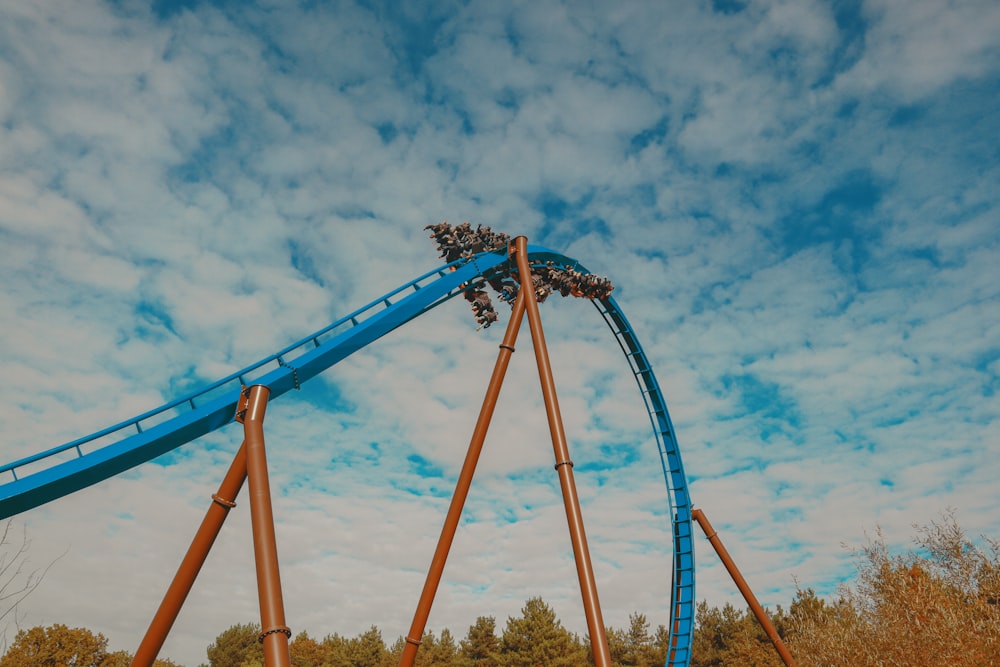 a roller coaster in the middle of a park