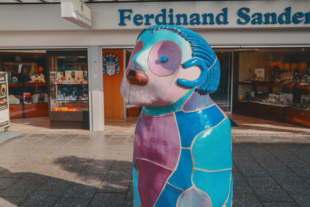 a statue of a bear in front of a store