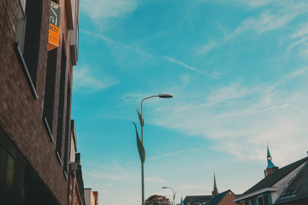 a street light on a city street next to a building