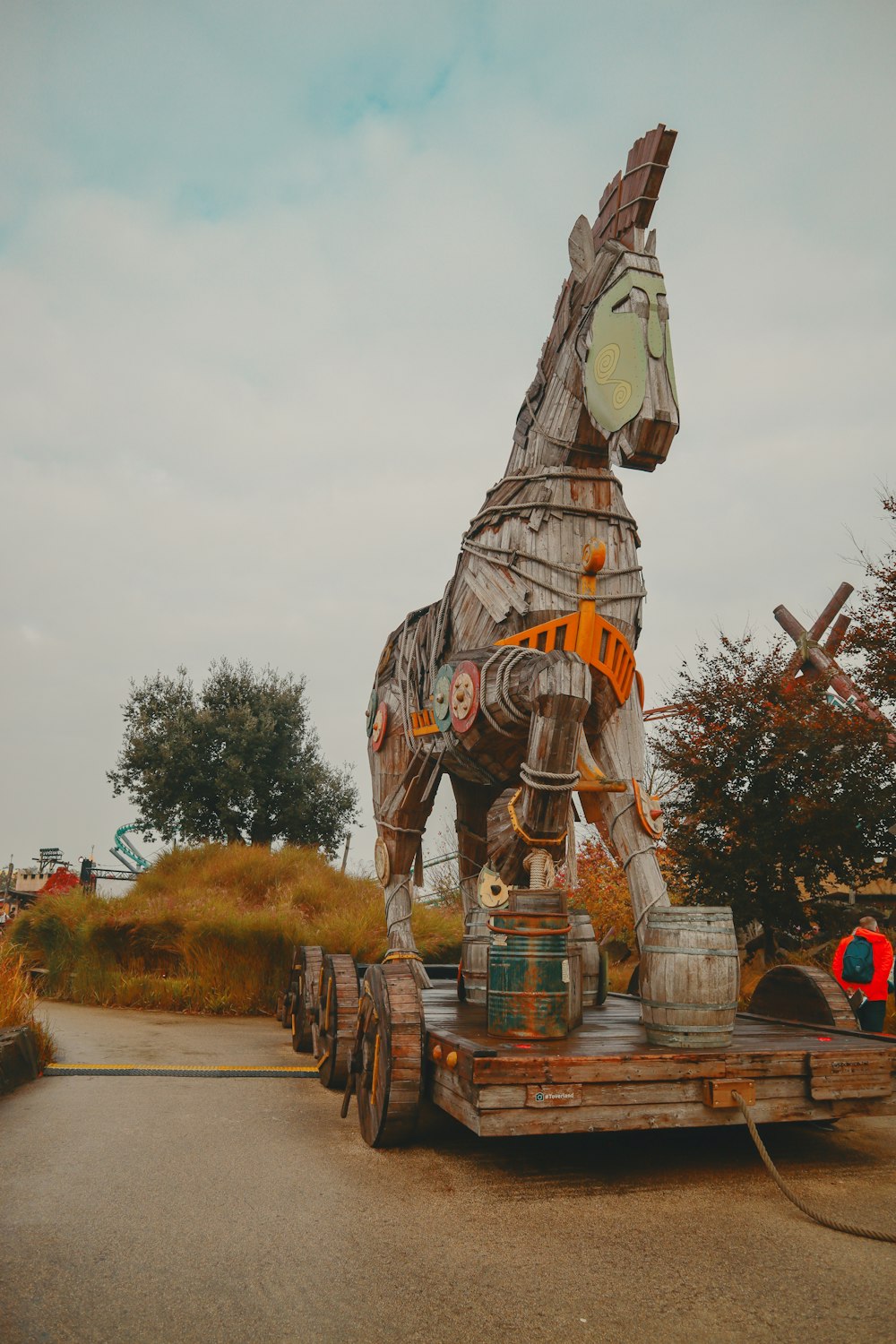 a large wooden horse statue on a trailer