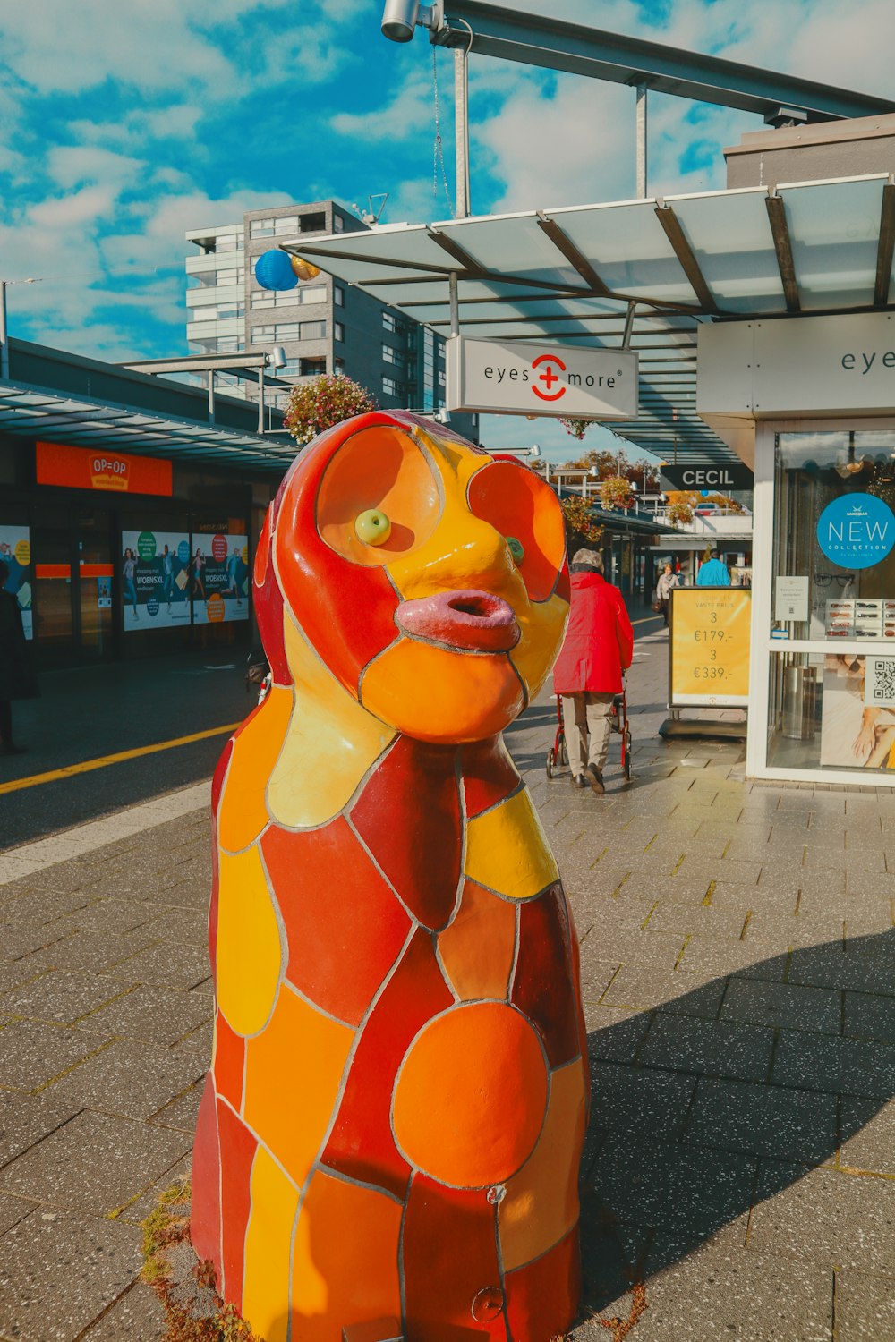 a statue of a bear on the side of the road