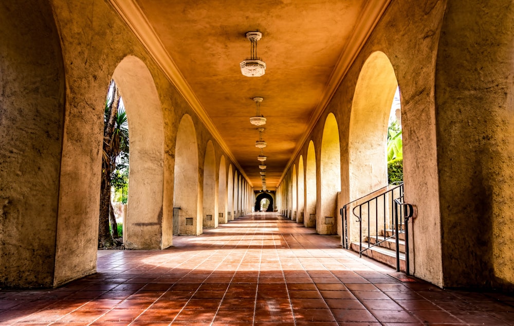 a long hallway lined with columns and lights