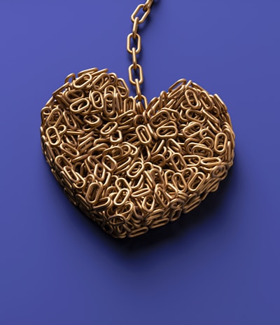 a heart shaped object with a chain attached to it