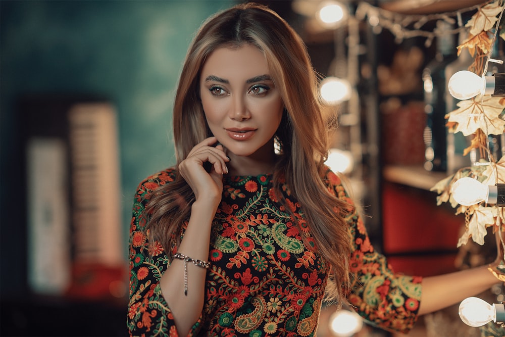 a beautiful woman standing in front of a mirror