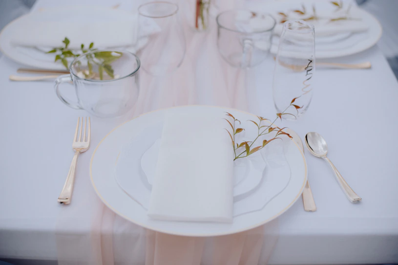 A beautifully arranged dining table with elegant tableware.