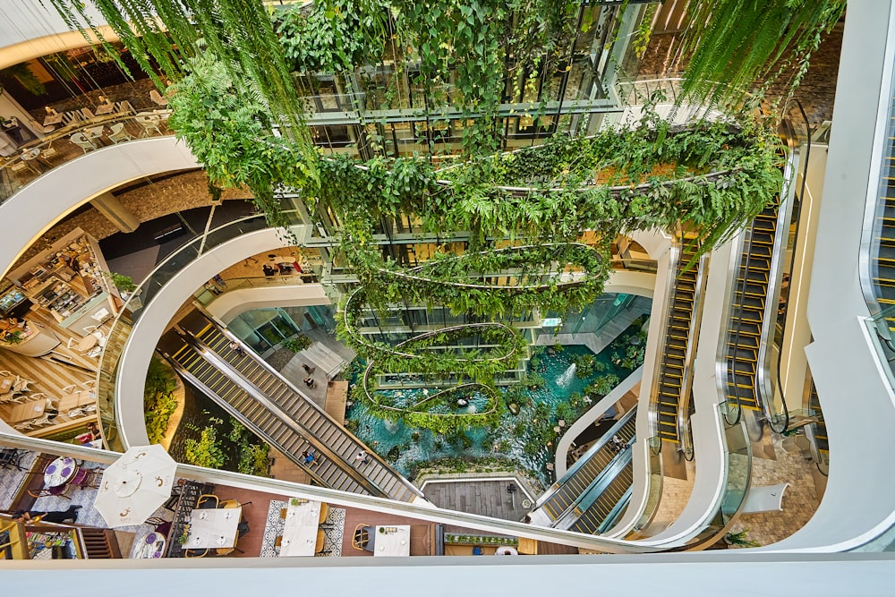 a view from the top of an escalator looking down at a building with