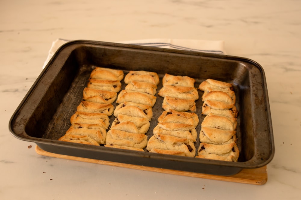 a pan filled with cookies on top of a counter