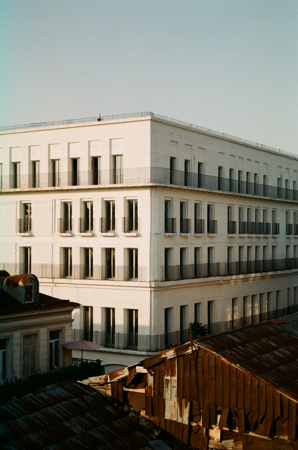 a large white building with balconies on top of it