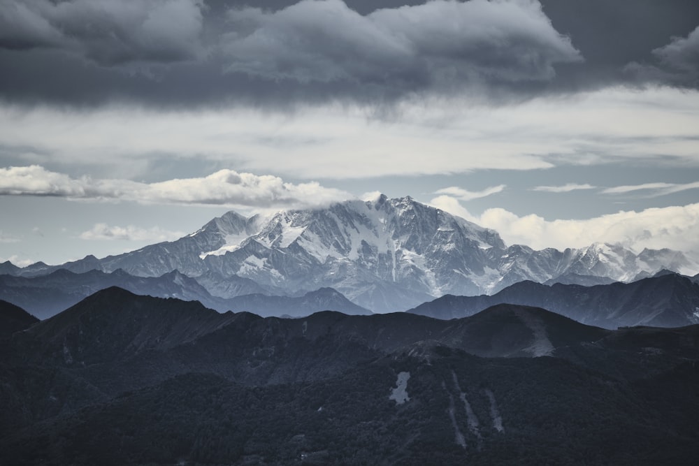 a view of a mountain range under a cloudy sky