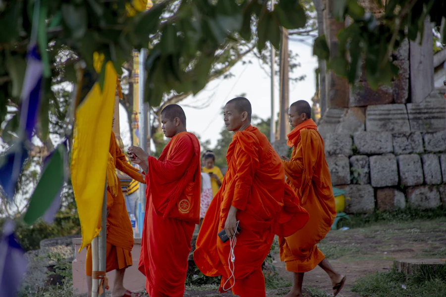 A procession of Cambodian monks in saffron robes