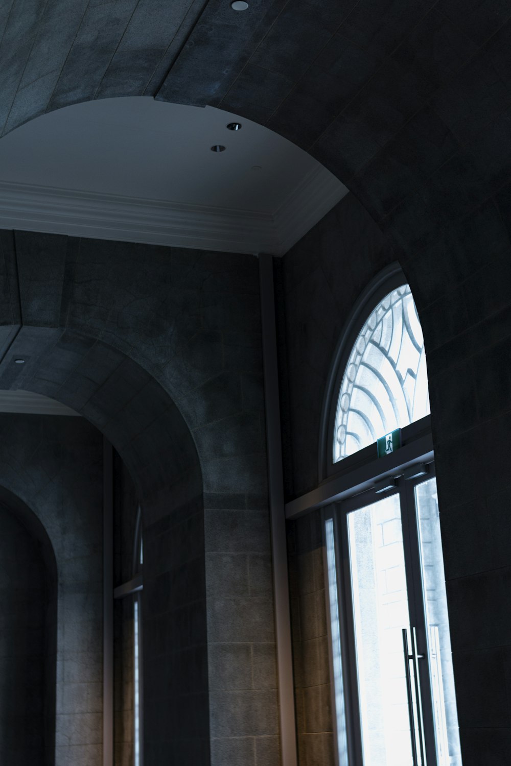 a room with a large window and a clock on the wall