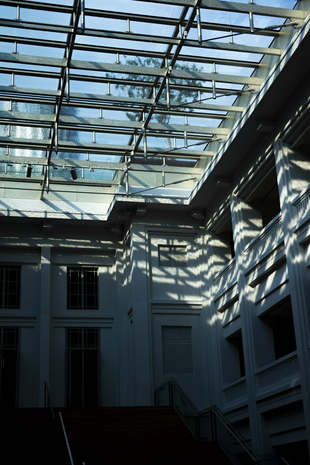 a building with a glass roof and stairs