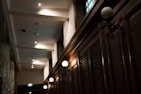 Elegant wall sconces illuminating a hallway.