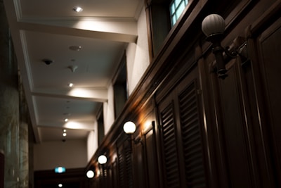 Stylish wall sconces casting soft light in a hallway.