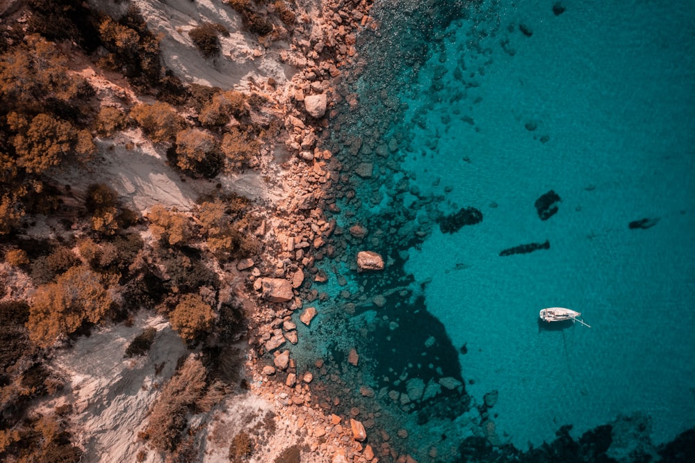 an aerial view of a boat in the water