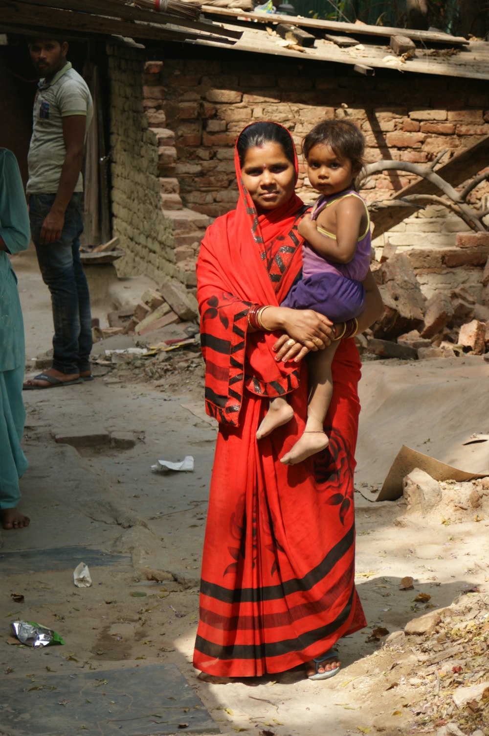 a woman holding a child in her arms