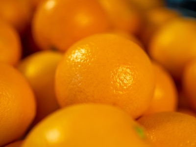 Close-up of ripe, juicy oranges glistening with morning dew.