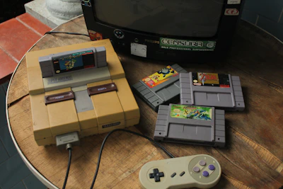 A lineup of classic SNES cartridges neatly arranged on a wooden shelf.