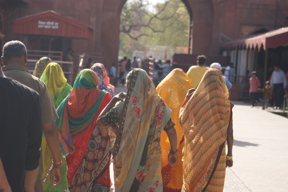 a group of people walking down a street