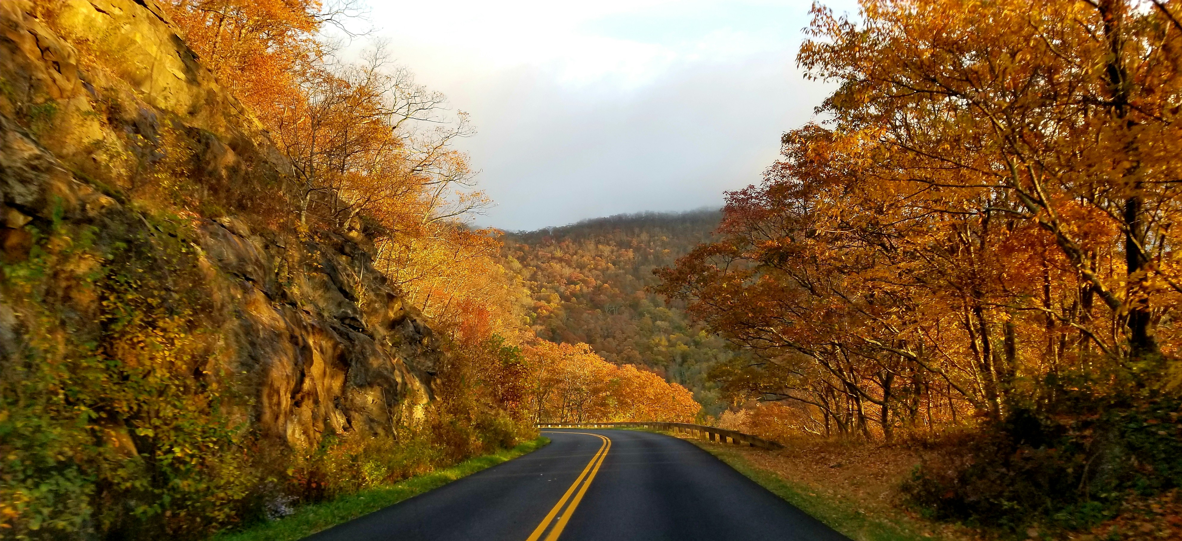 a road with a mountain in the background