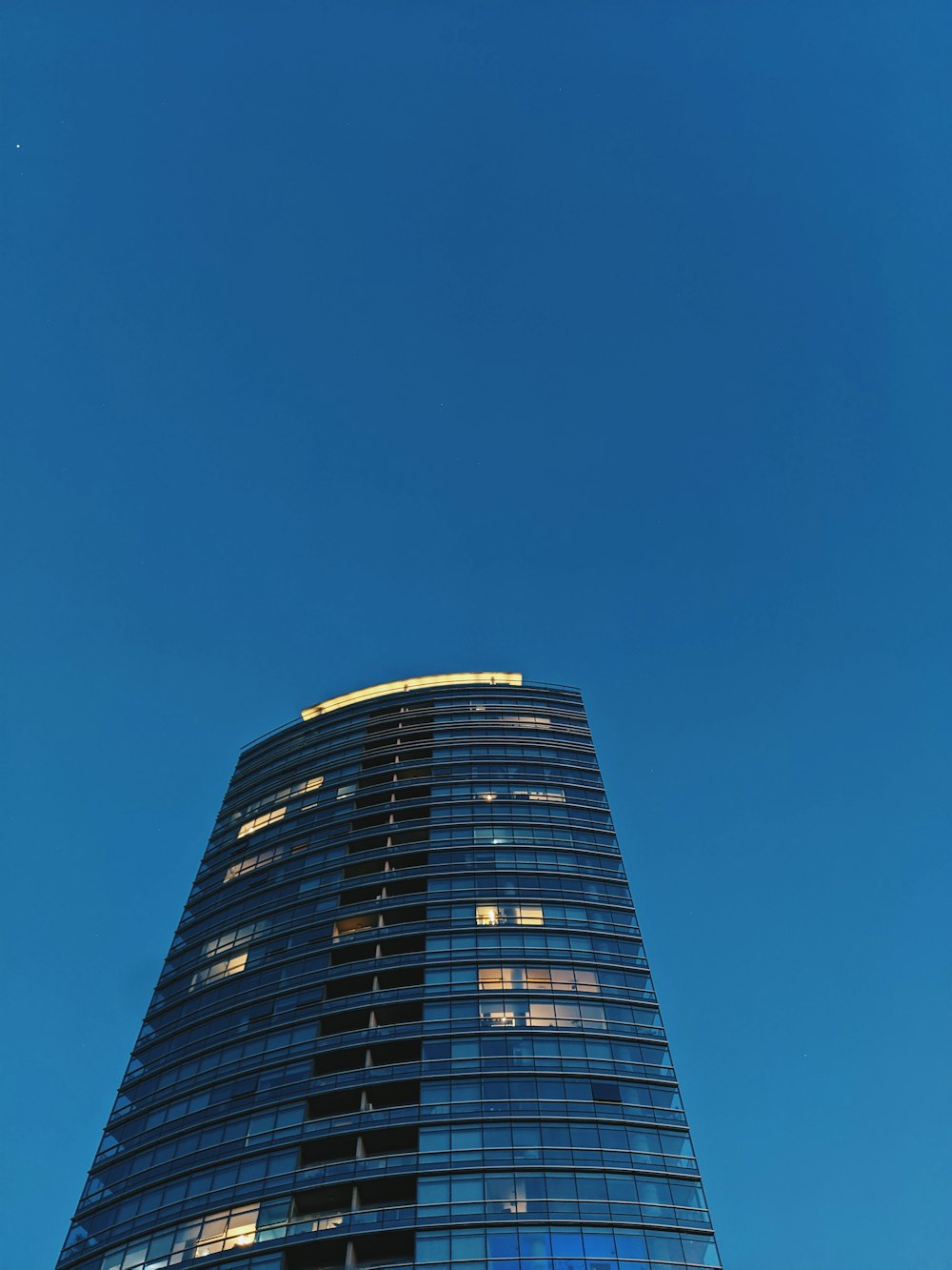 a very tall building with a clock on it's side