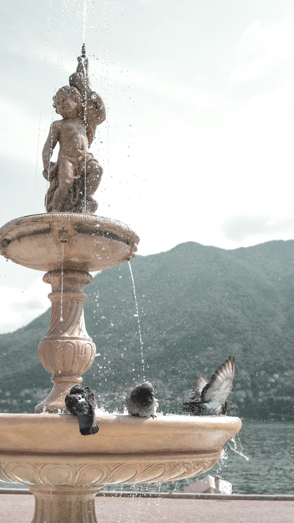 a fountain with a statue on top of it