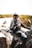 a man riding a four wheeler on top of a sandy beach