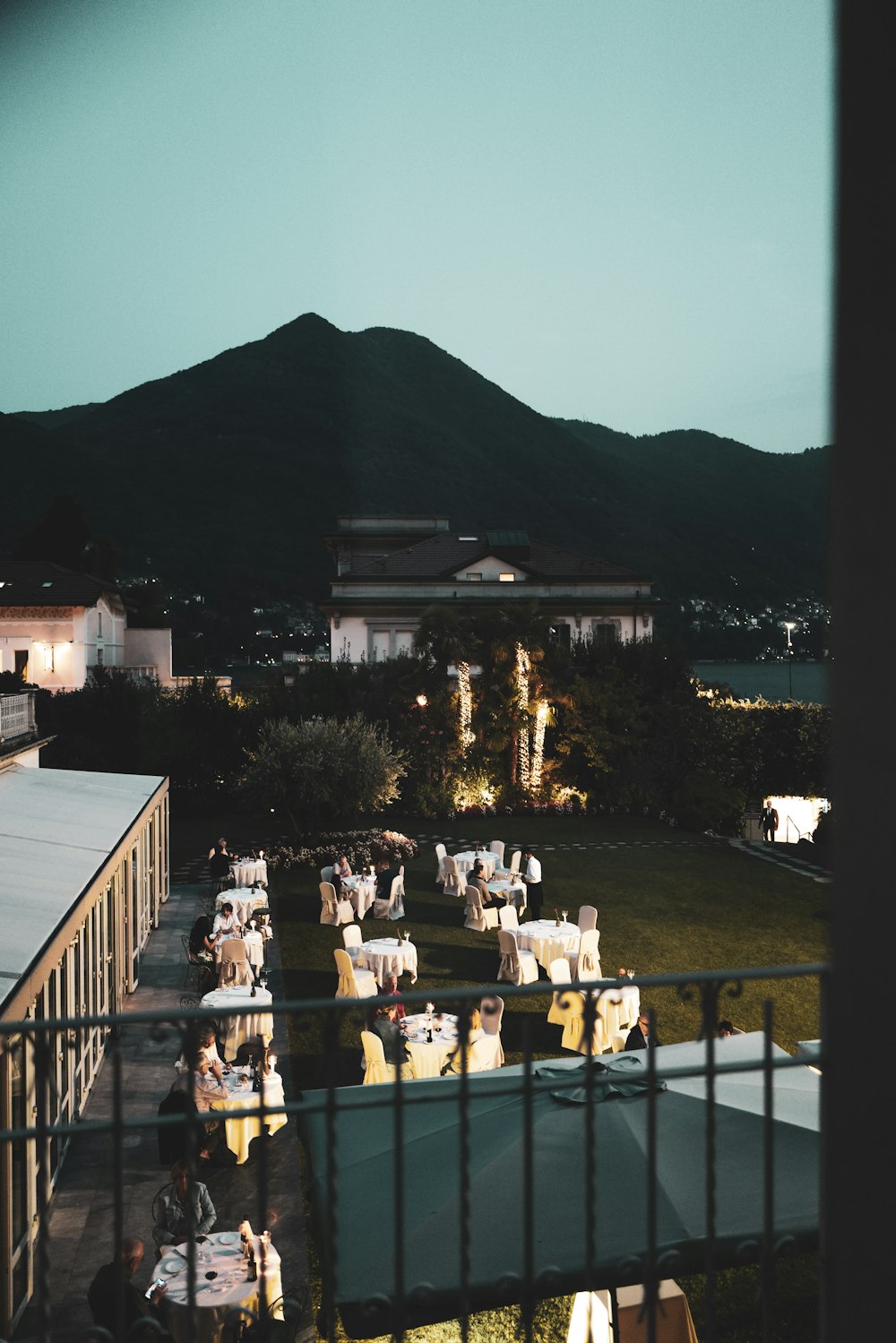 an outdoor dining area with a view of the mountains