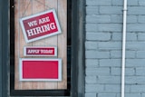 a sign that says we are hiring and apply today