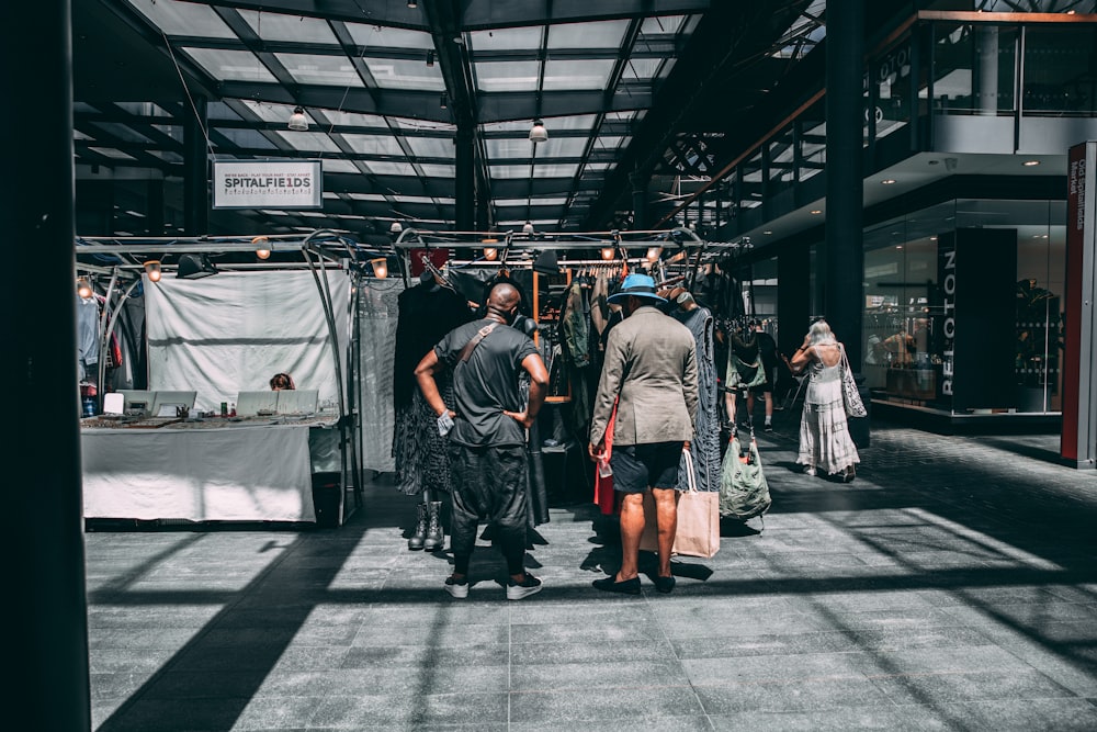 a group of people standing around in a building