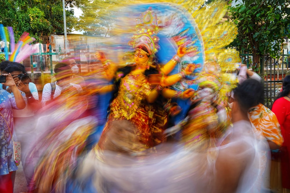 a blurry photo of a woman dancing in a parade