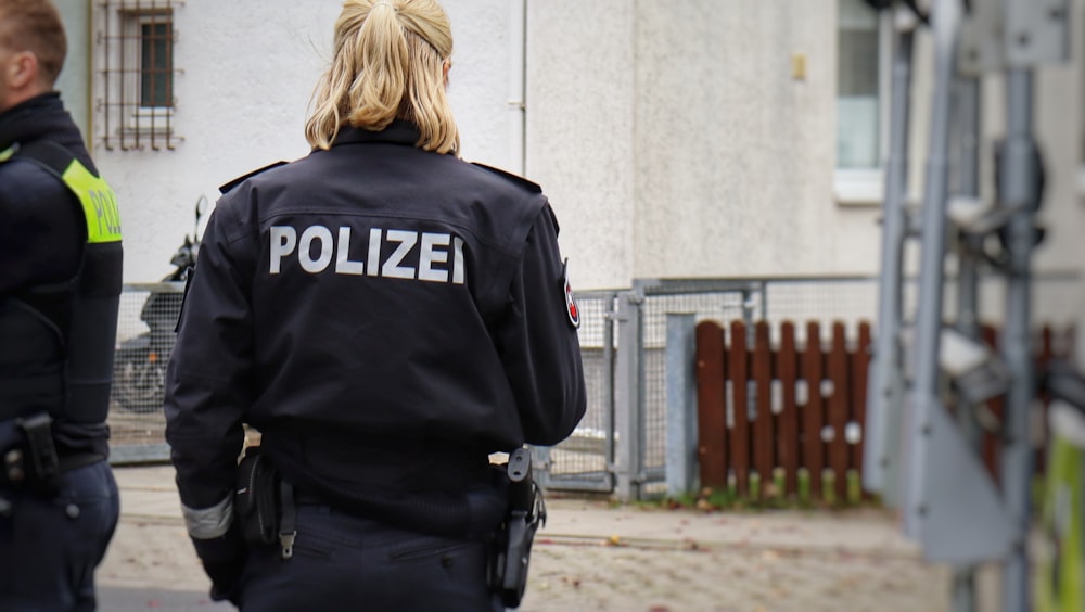 a couple of police officers standing next to each other