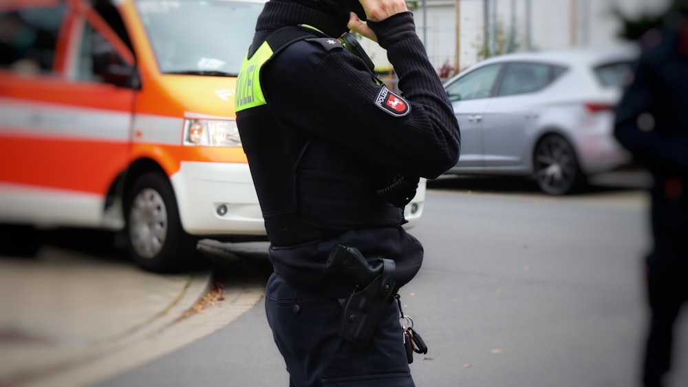 a police officer talking on a cell phone