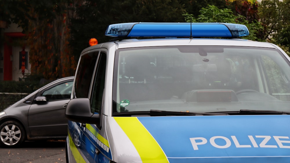 a police car is parked in a parking lot