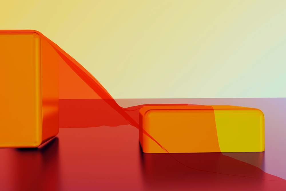 an orange and yellow object on a red surface