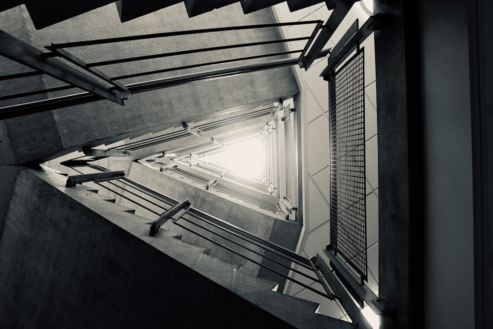 a view of a stairwell from the top of the stairs