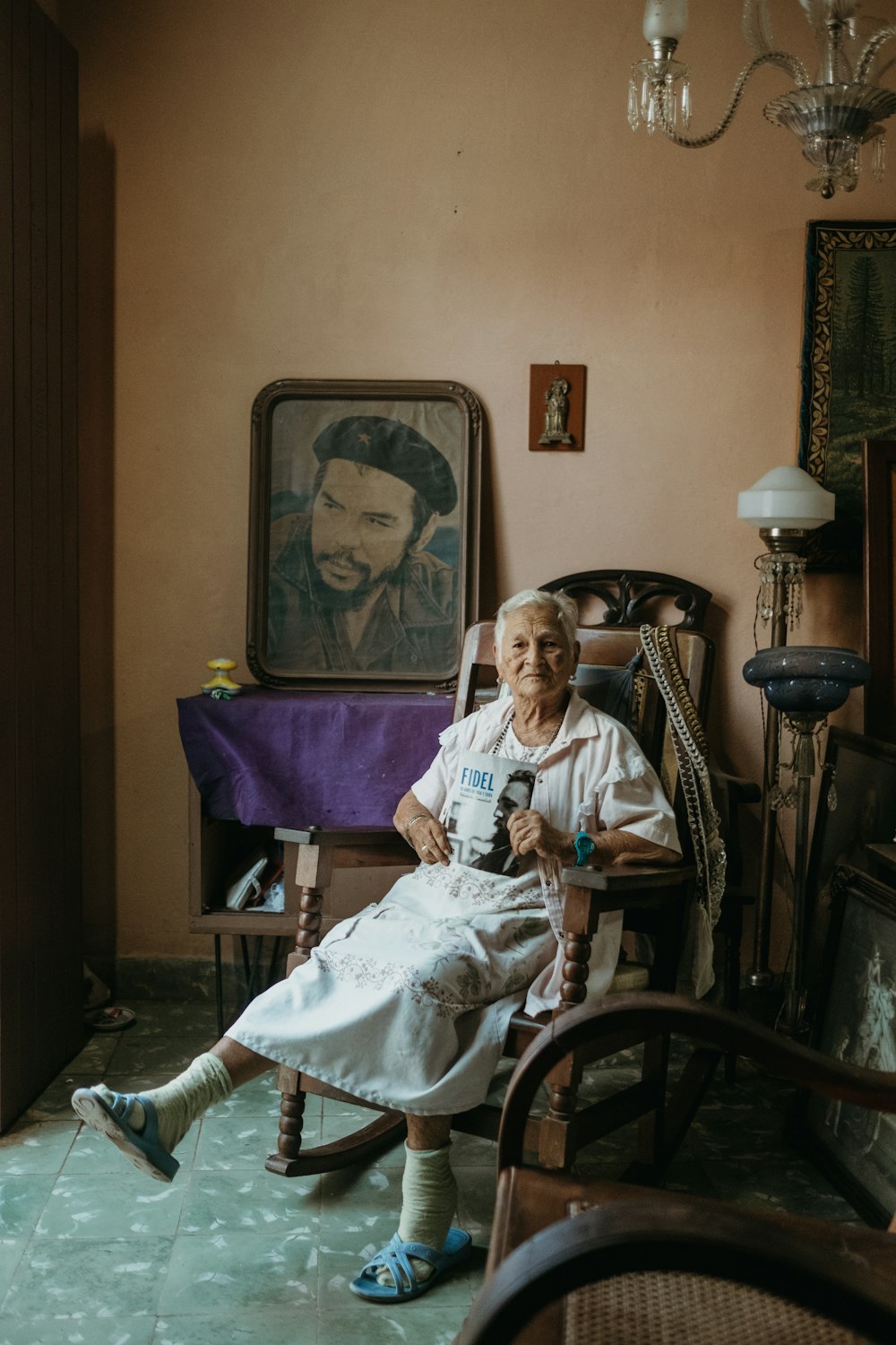 a woman sitting in a chair in a room