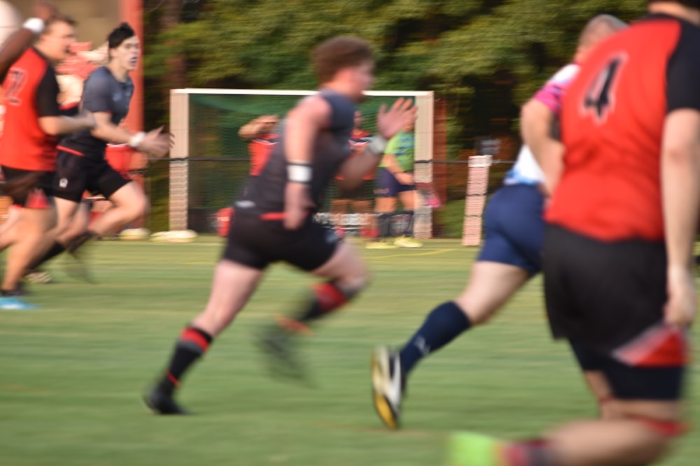 a group of men playing a game of soccer