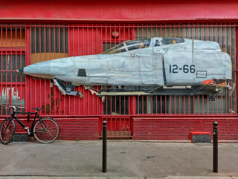 a plane that is sitting on the side of a building