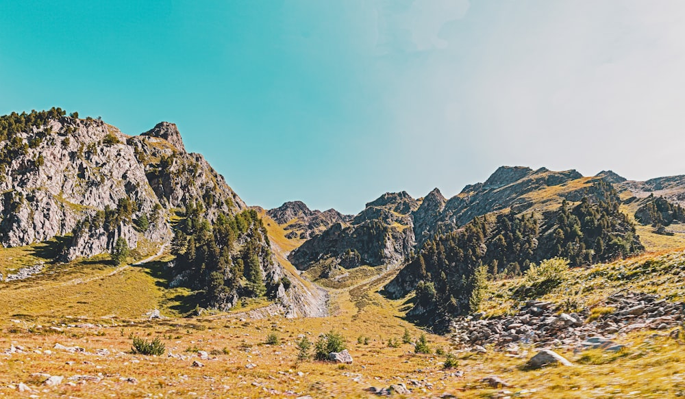 a view of a mountain range from a moving vehicle