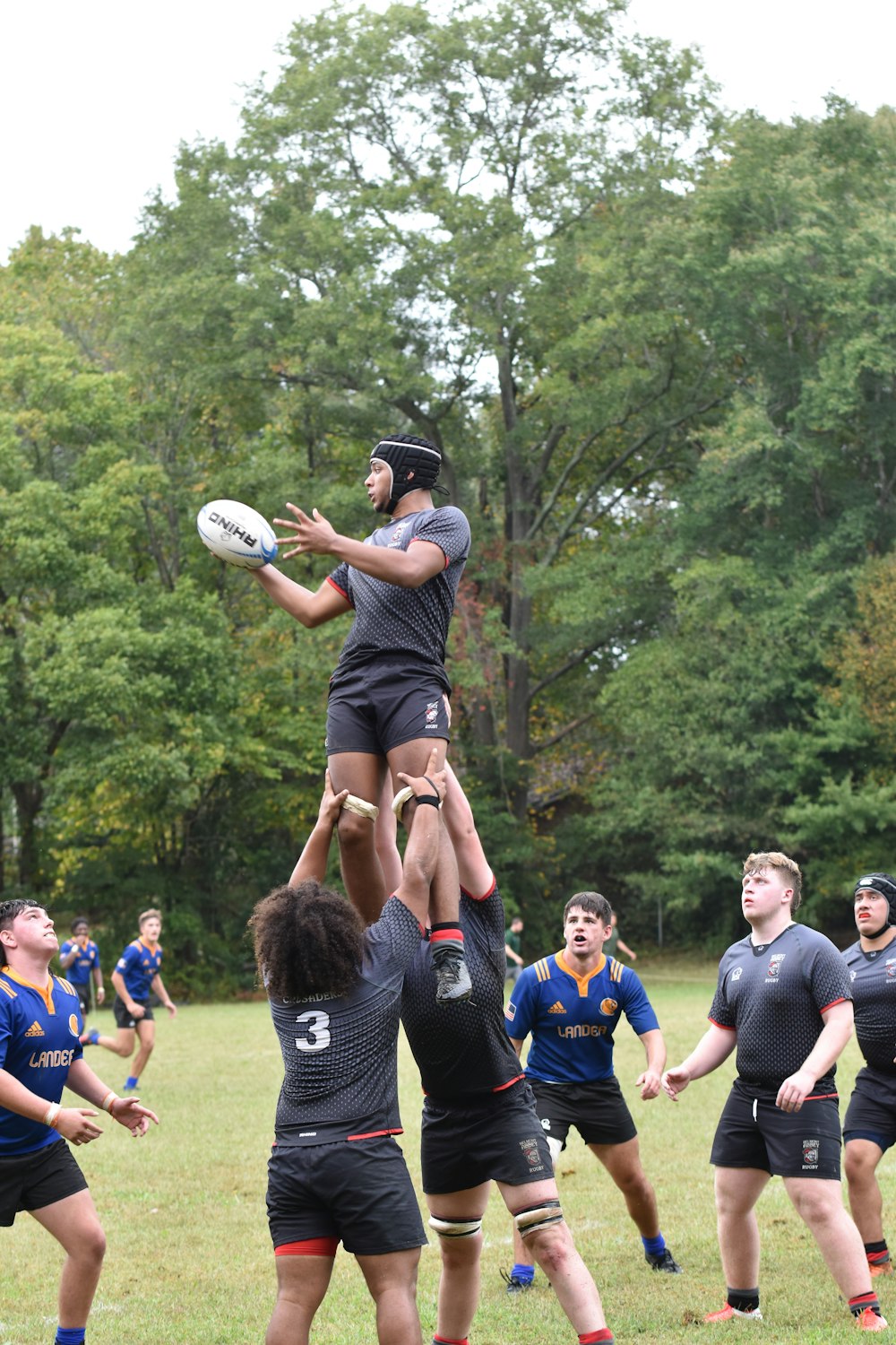 a group of people playing a game of frisbee