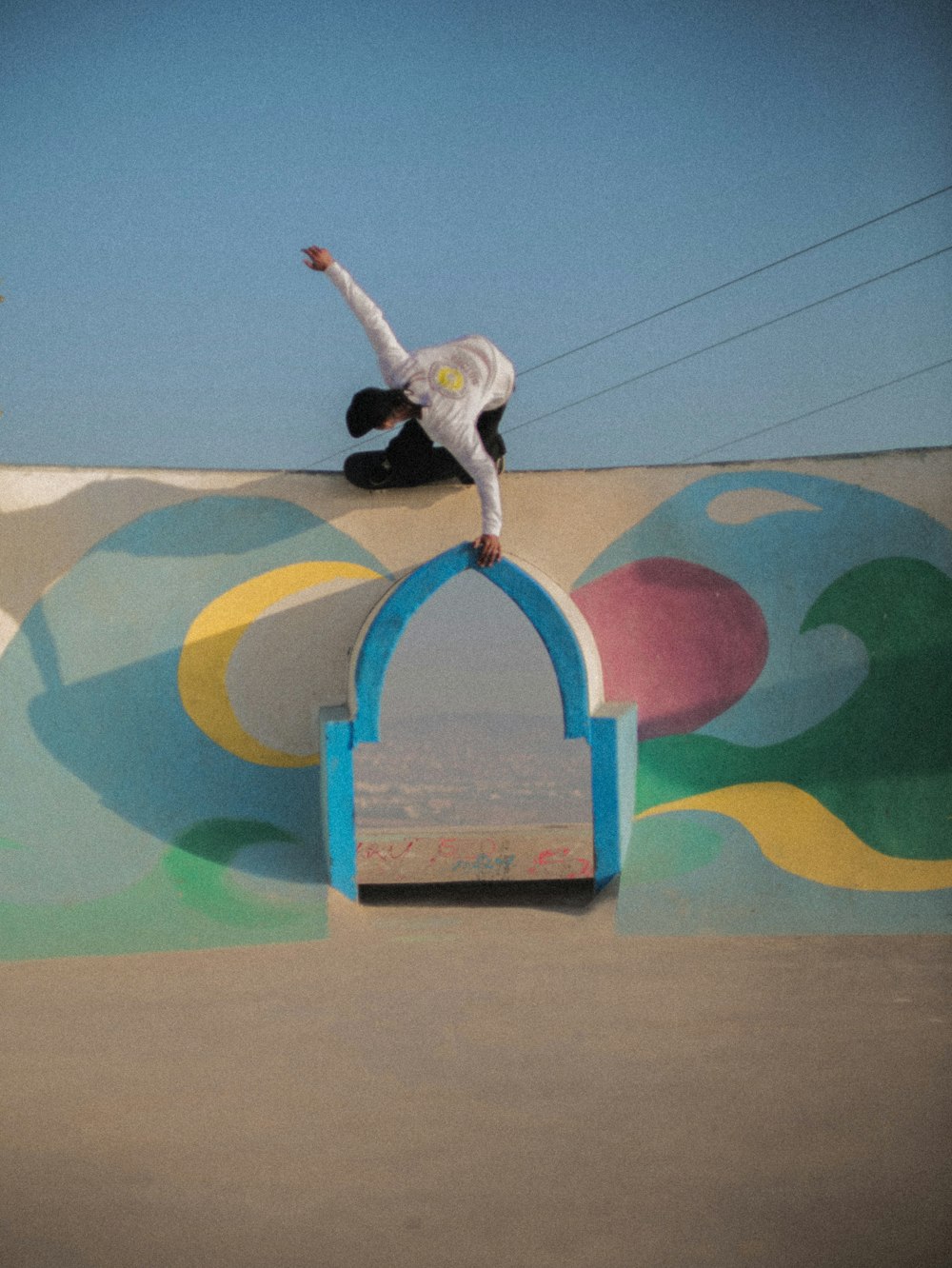 a man riding a skateboard up the side of a ramp