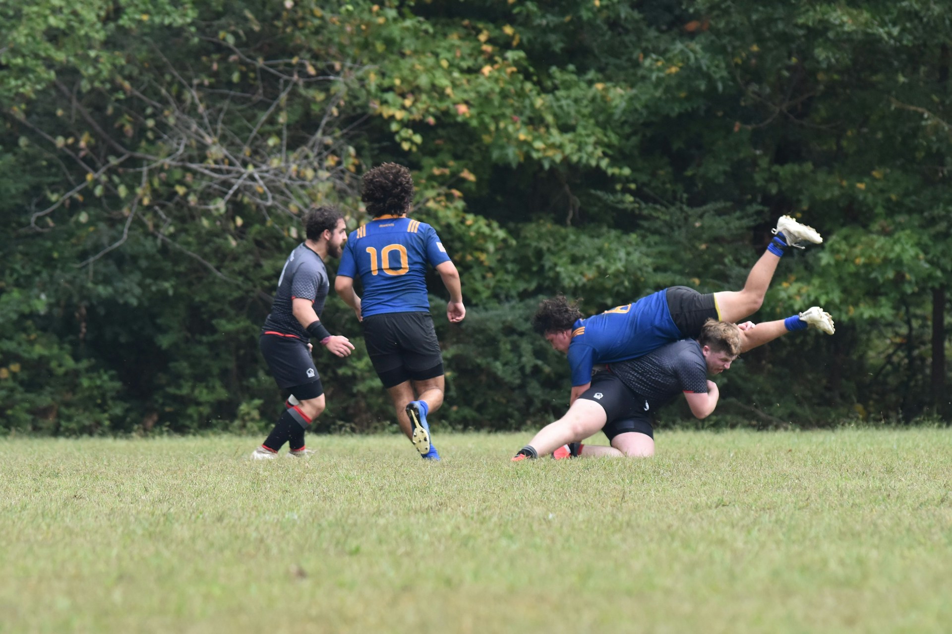 a group of young men playing a game of soccer