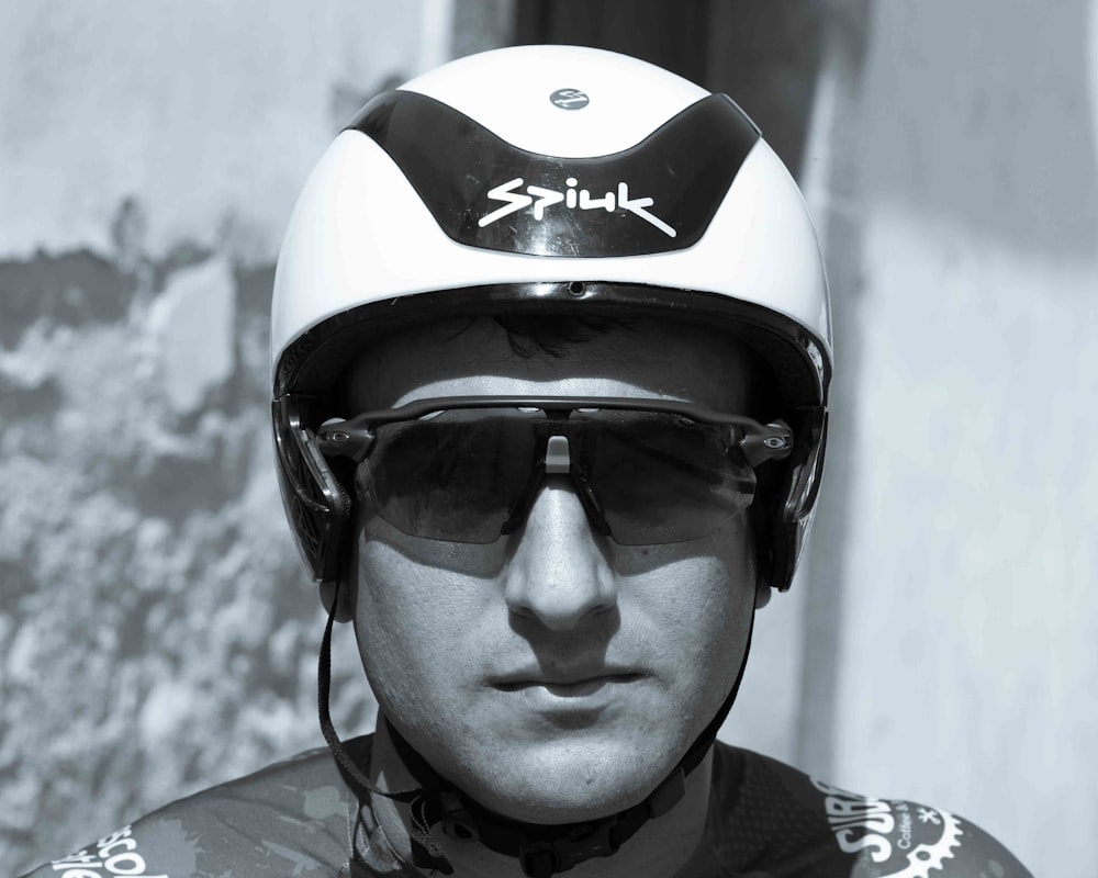 a man wearing a helmet and sunglasses