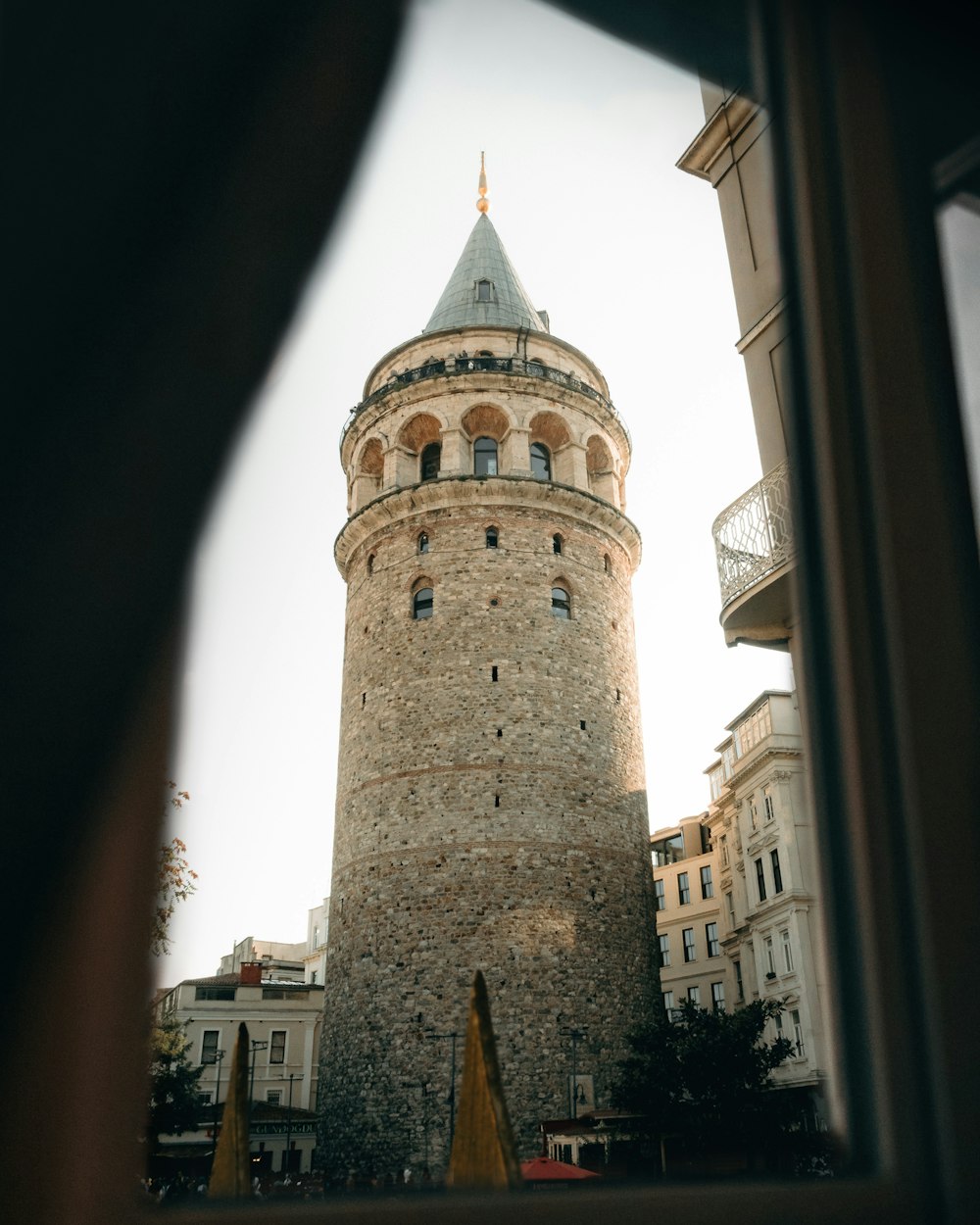 a tall tower with a clock on the top of it