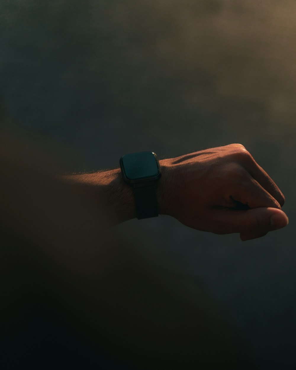 a person's hand with a watch on it