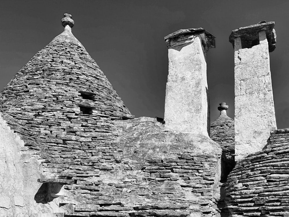 a black and white photo of a stone building