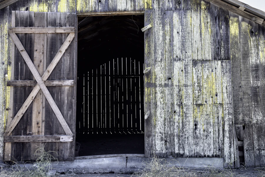 Rustic wooden barn with a door and gate