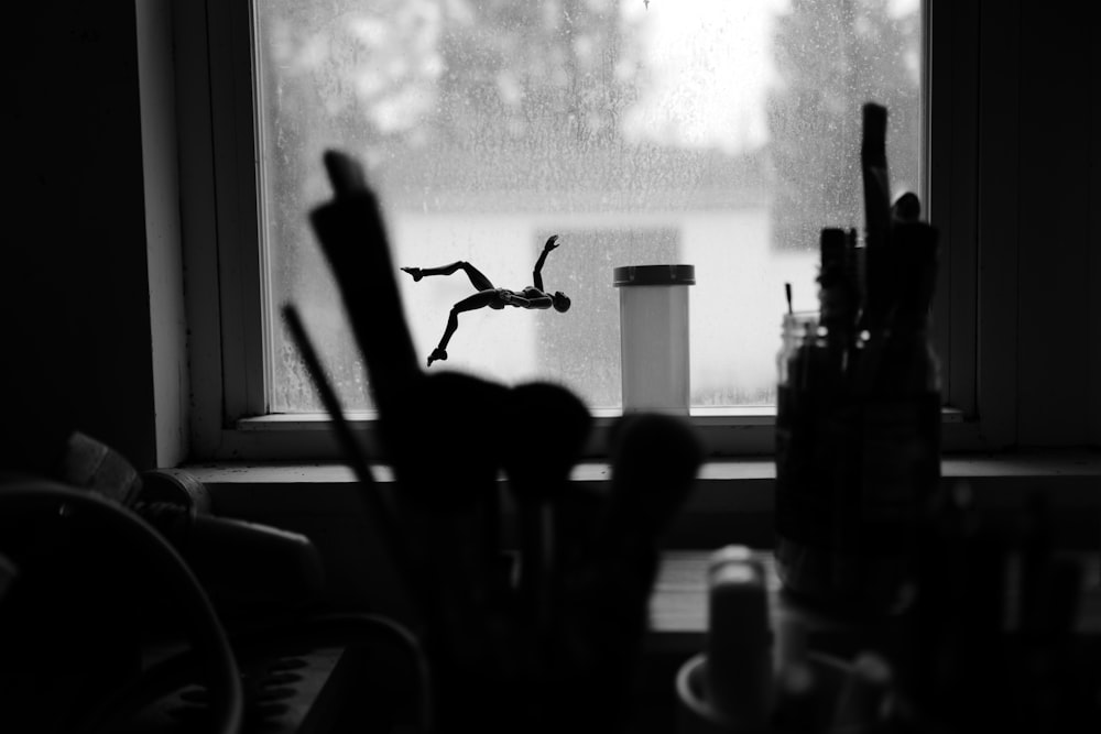 a black and white photo of a window sill